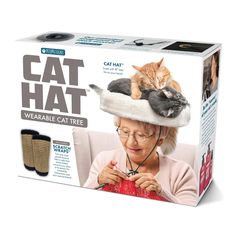 the cat hat has two cats sleeping on it's head and one is knitting