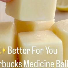 a hand is picking up some cubes of soap from a pile with the words, better for you starbucks medicine balls