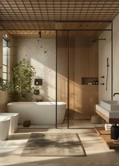 a bathroom with a bathtub, sink and toilet in it next to a window