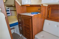 the inside of a boat with wood paneling