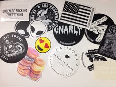 various stickers and decals on a white surface, including an image of the american flag