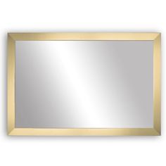 a gold framed mirror on a white wall