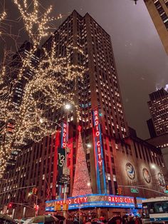 the radio city christmas tree is lit up in red, white and blue for the holiday season