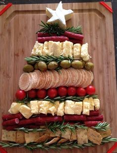 a christmas tree made out of food on top of a cutting board