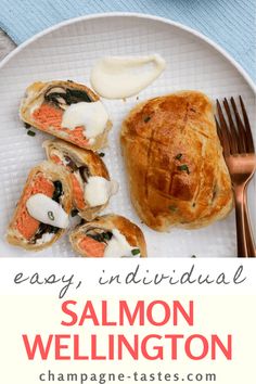 salmon wellington on a white plate with a fork and blue napkin next to it, along with the words easy individual salmon wellington