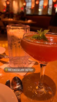 a close up of a drink in a glass on a table