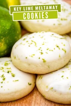 several cookies with white icing and green sprinkles next to each other