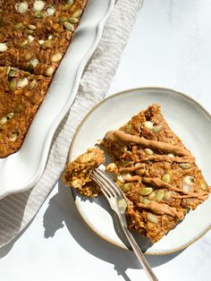 a plate with some food on it next to a pan filled with bread and nuts