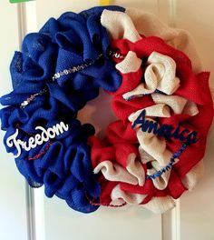 two red, white and blue scrunffles hanging on a door