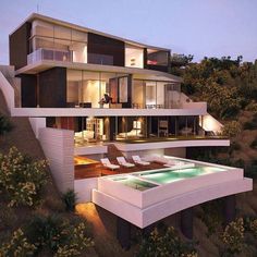 an aerial view of a modern house at dusk