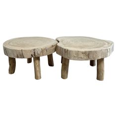 two wooden stools sitting next to each other