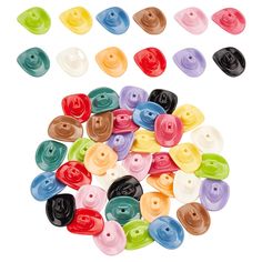 many different colored buttons on a white background