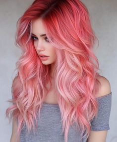 Wavy hair with coral pink hues, offering a bohemian and beachy appearance. Perfect for a relaxed and carefree look Pink Coral Hair, Highlights Subtle, Pink Hair Ideas, Pink Goddess, Pink Hair Color Ideas, 100 Faces, Coral Hair, Pink Blonde