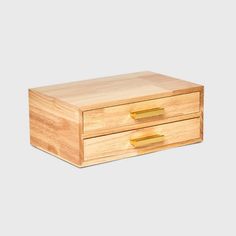 a wooden box with two drawers on it