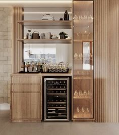 an appliance with wine glasses and bottles on the shelves in front of it