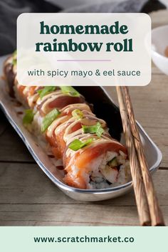 homemade rainbow roll with spicy mayo and el sauce on the side next to chopsticks