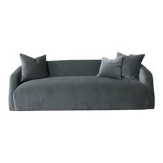 a gray couch with two pillows on it