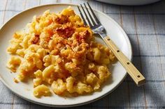 a white plate topped with macaroni and cheese