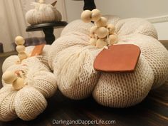 the pumpkins are made from yarn and wood