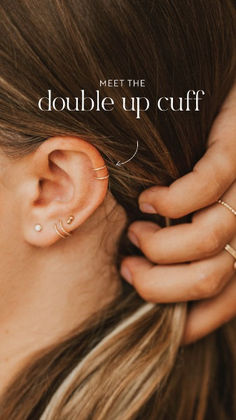 a woman with ear piercings and the words meet the double up cuff