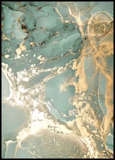 an abstract painting with blue and gold colors on it's surface, as seen from above