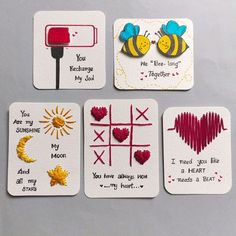 four cards with different designs and words on them