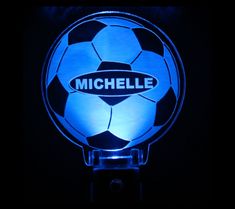 a lighted soccer ball with the name michelle on it is shown in blue