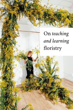 a woman standing in front of a green plant with the words on teaching and learning floristry