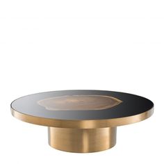 a black and gold coffee table with a round glass top on an isolated white background