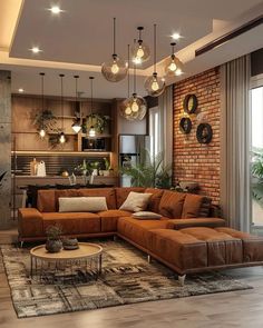 a living room filled with lots of furniture next to a brick wall and flooring