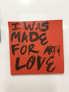 an orange piece of paper with the words i was made for art and love on it