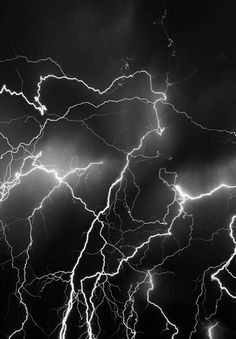 a black and white photo of lightning in the sky