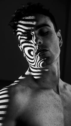 a man with black and white stripes on his face