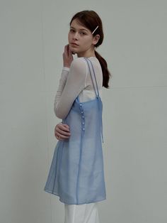 This is a modern and feminine dress by SIEERING that is made out of high quality and sturdy material. With distinctive mood of the design and comfortable wear, you can style it for your casual daily outfit.- Sheer texture of organza fabric- Adjustable shoulder strap- Feminine and romantic mood Chic Blue Organza Dress, Spring Daywear Organza Dress, Spring Organza Dress For Daywear, Blue Sheer Daywear Dresses, Blue Sheer Dress For Daywear, Light Blue Sheer Dress For Daywear, Sheer Blue Mini Dress For Spring, Blue Sheer Mini Dress For Spring, Sheer Blue Dress