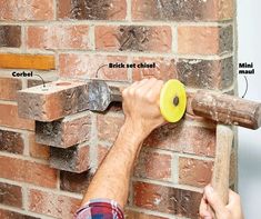 a man is working on a brick wall