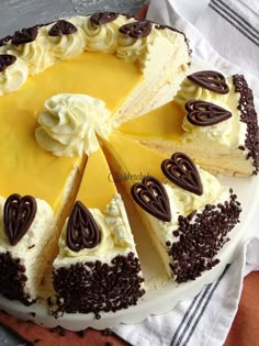 a cake with white frosting and chocolate decorations