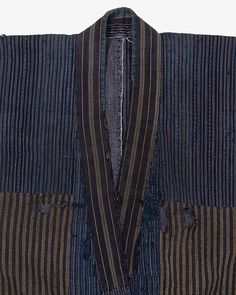 a blue and black striped jacket on a white background