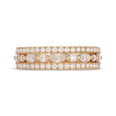 an 18k rose gold ring with three rows of diamonds on each band, set against a white background