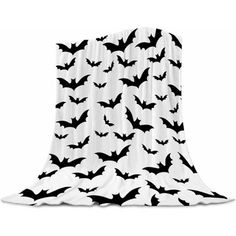 black and white bat pattern on the back of a blanket