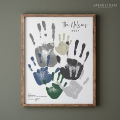 a wooden frame holding a handprint with the names of two children's hands