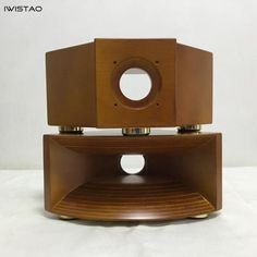 two wooden speakers sitting on top of each other