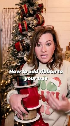 a woman is holding a christmas present in front of a tree with the words how to add ribbon to your tree