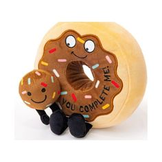 a stuffed toy with a donut on it's back and the words, you complete me