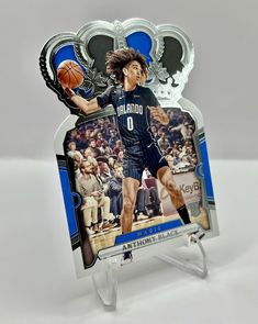 This 2023-24 Crown Royale sports trading card features Scoot Henderson, a rookie player from the Portland Trail Blazers team in the National Basketball Association (NBA). The card has a silver foil design and is a short print, making it a valuable addition to any collection. The card also includes memorabilia and is an insert in the set, making it a unique and sought-after item. With its beautiful design and rare features, this card is perfect for any basketball fan who wants to add a special piece to their collection. Scoot Henderson, Rare Features, Foil Design, Portland Trail Blazers, Portland Trailblazers, Basketball Fans, Trail Blazers, National Basketball Association, Sports Basketball