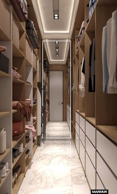 an empty walk in closet with shelves and shoes