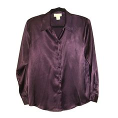 Indulge in the luxurious feel of satin with our FairSet vintage blouse in a stunning deep plum shade. This blouse perfectly captures the sophisticated essence of the 1980s with its classic collared neckline and long sleeves. Designed to enhance any ensemble, it offers a versatile fit that is flattering for all occasions--be it formal events, evening gatherings, or as a refined daily wear piece.     *  Size: Women's 10 (Medium)     *  Color: Deep Plum     *  Fabric: 100% Polyester Satin, providin Plum Fabric, Satin Button Up, Satin Long Sleeve, Deep Plum, 80s Style, Purple Blouse, Vintage Blouse, Purple Shirt, Satin Shirt