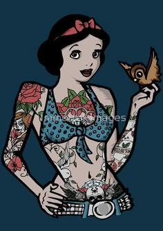 a woman with tattoos holding a bird in her hand