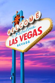 the welcome to fabulous las vegas sign in front of a colorful sky with clouds at sunset