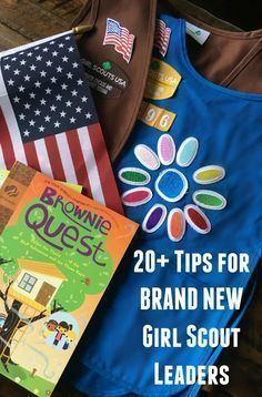 some books and t - shirts on a table with the title 20 tips for brand new girl scout leaders