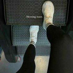 two people standing in front of a metal platform with the words morning starts on it